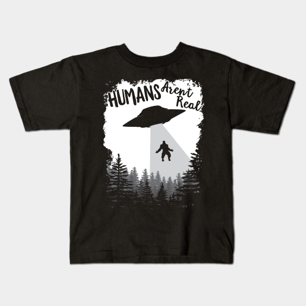 Humans Aren't Real Bigfoot Alien UFO Flying Object print Kids T-Shirt by theodoros20